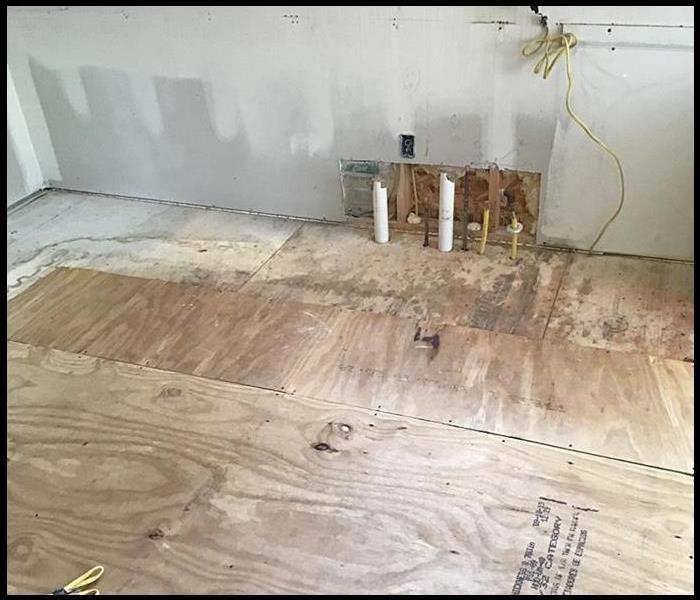 Subflooring in a kitchen affected by water damage