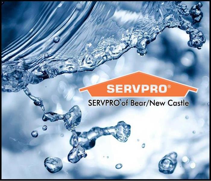 Water splashing behind the SERVPRO Logo