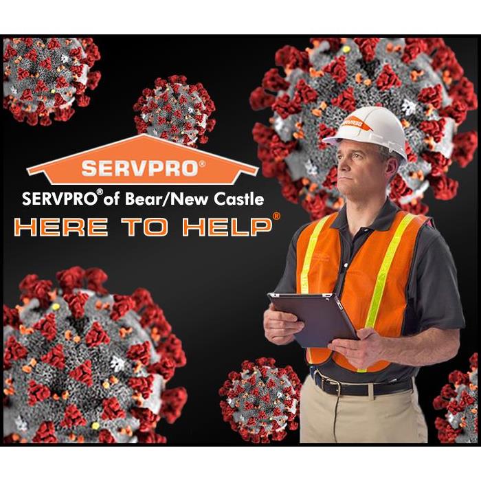 SERVPRO Cleaning & Disinfecting Specialist with a COVID-19 cell background